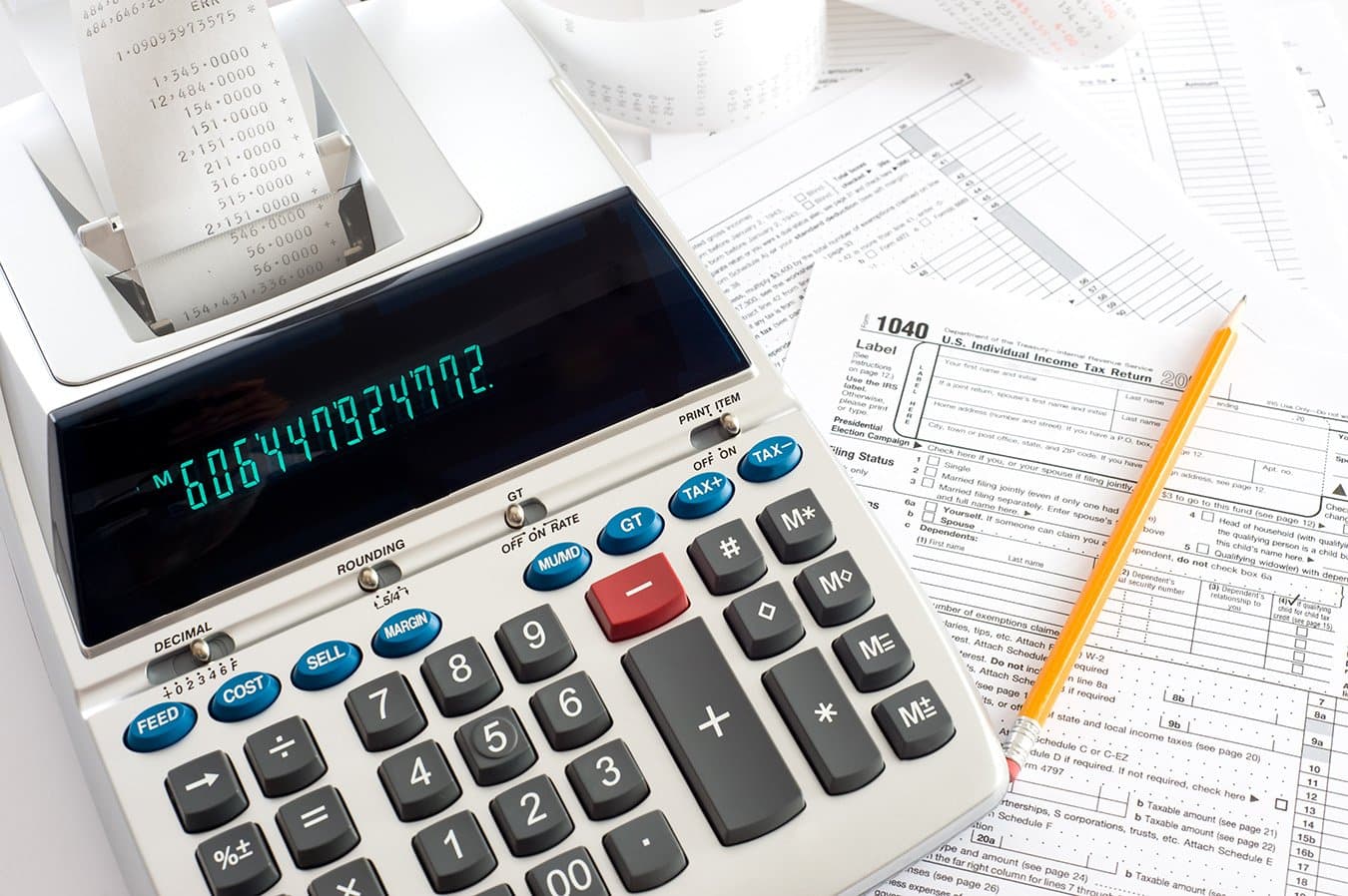An adding machine and tax forms